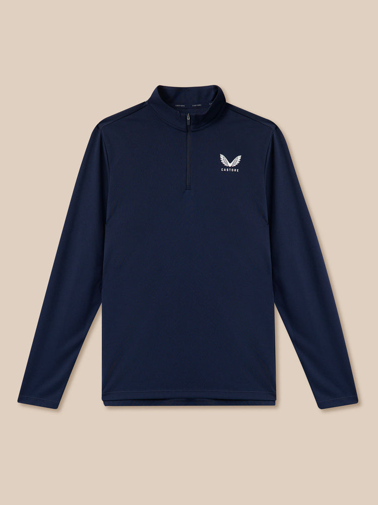 Navy long-sleeve shirt with a logo on a beige background