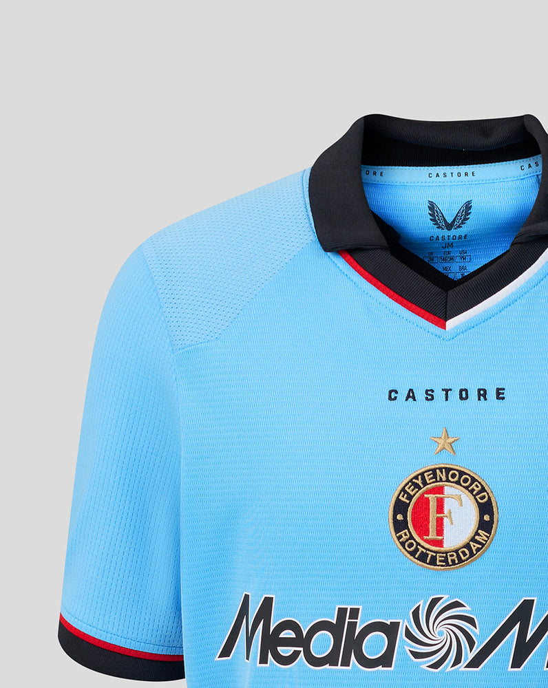 Light blue Feyenoord junior away shirt with black collar and Media Markt sponsor across the chest