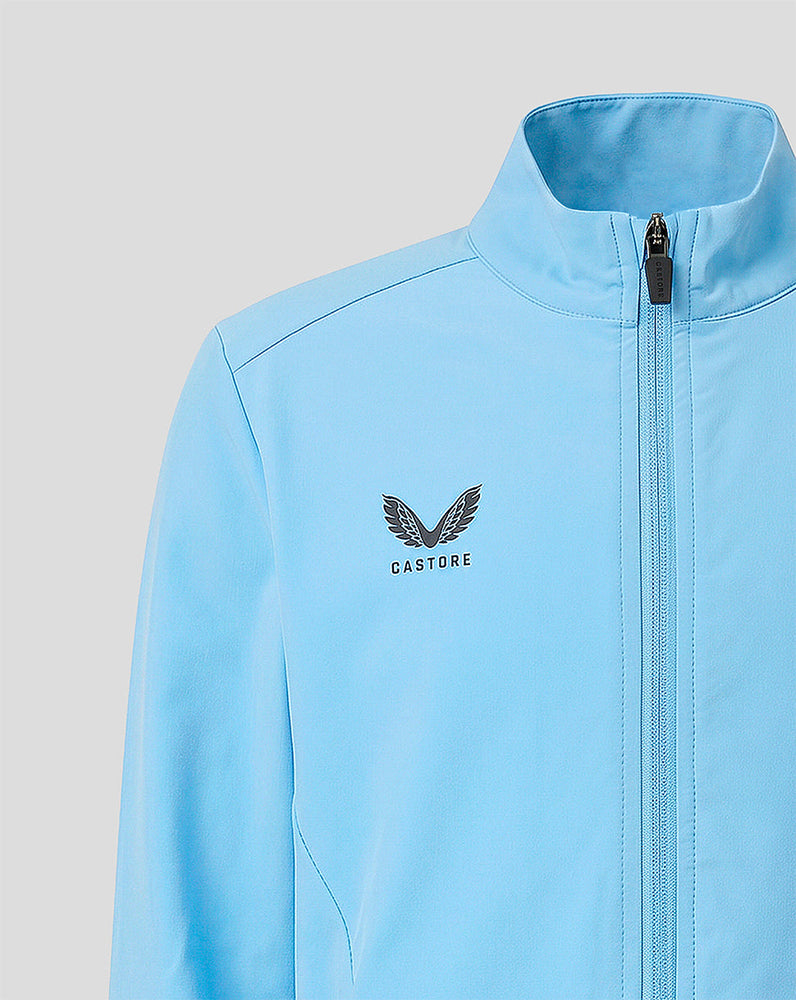 Chest area of the light blue Feyenoord junior jacket showing Castore logo and wing emblem.