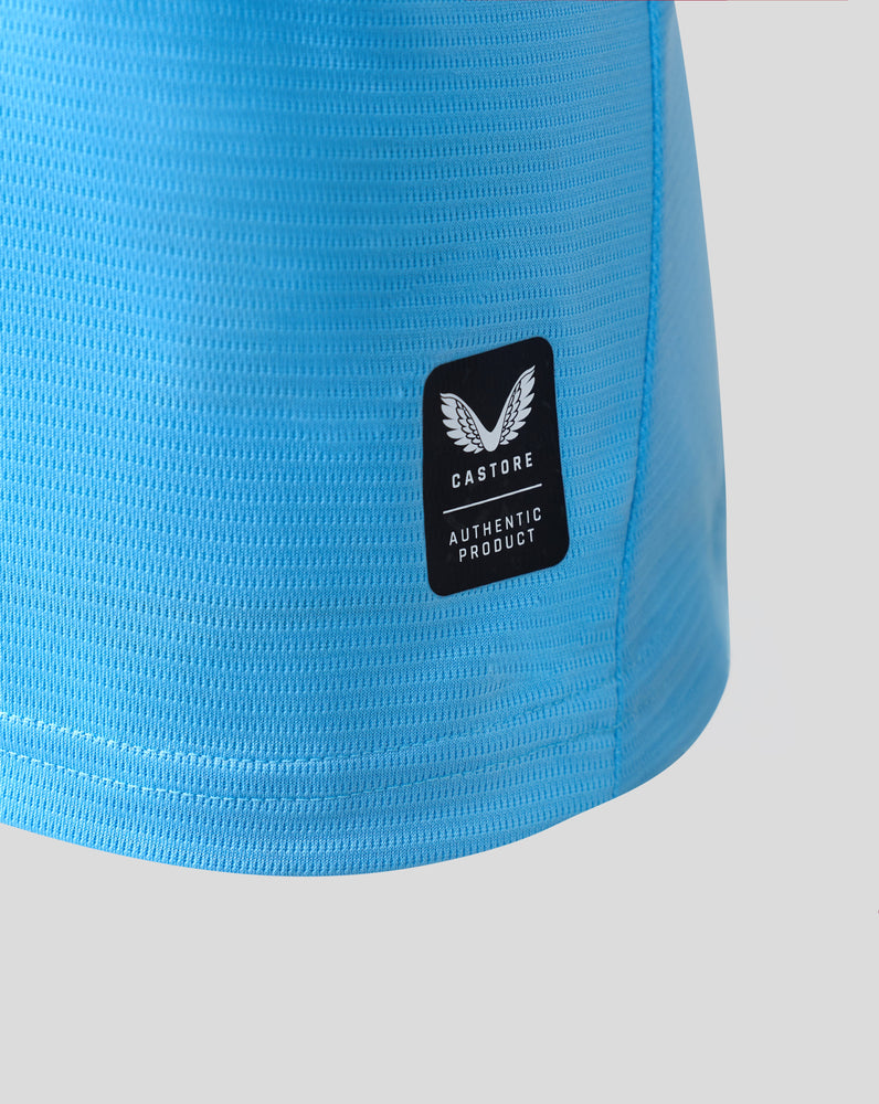 Close-up of blue textured Feyenoord Pro away shirt fabric with Castore badge